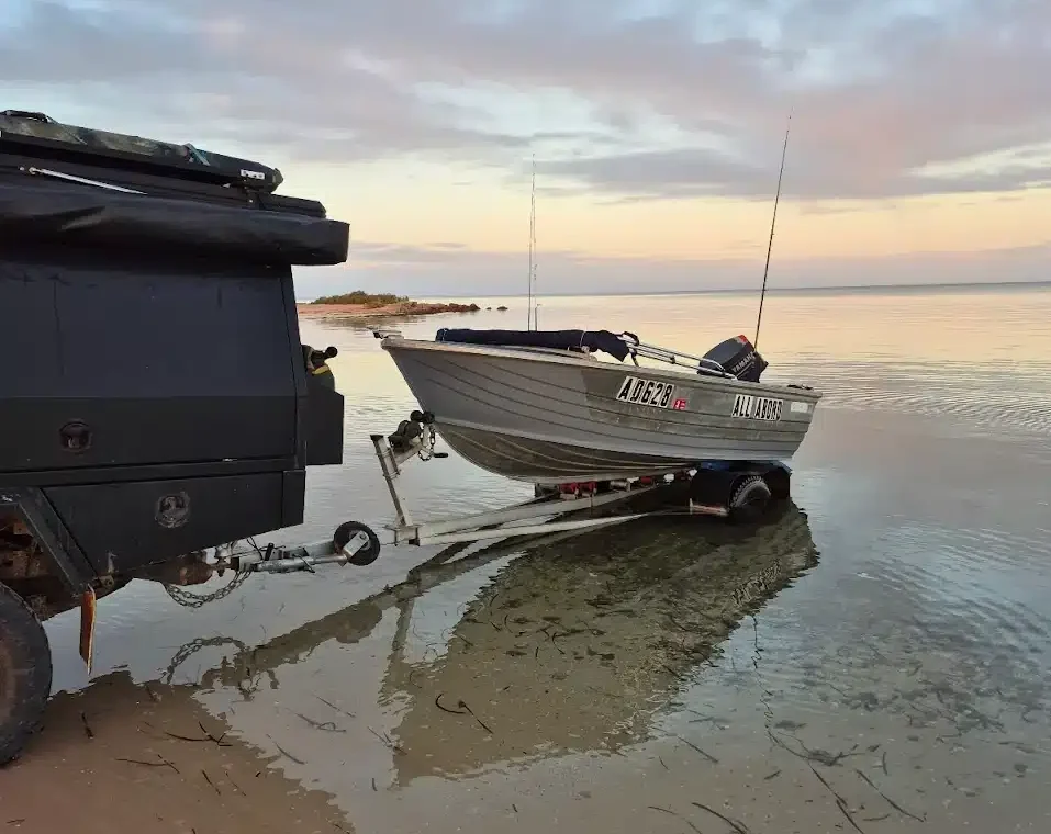 Hire a Boat Denham – Explore Shark Bay Waters Monkey Mia Boat Hire vessel anchored near Denham beach